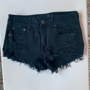 black ripped shorts
